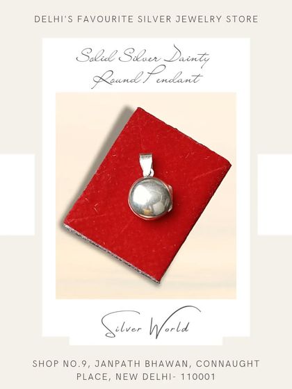 A simple and classic solid silver round locket pendant. This timeless piece is perfect for keeping a small photo or memento close to your heart.