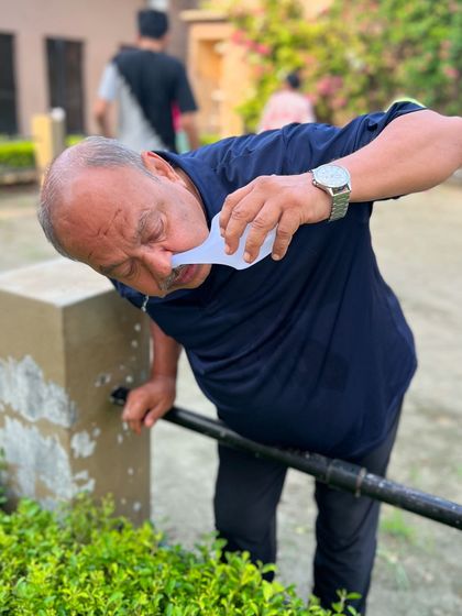 An older student practices Jal Neti. This technique is beneficial for people of all ages to maintain respiratory hygiene and boost immunity.
