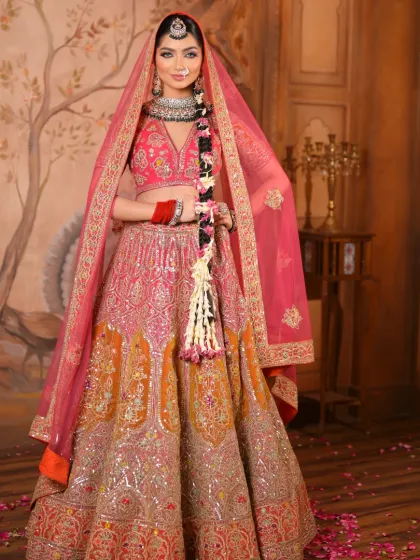 Here, the sheer pink dupatta frames her face beautifully. The makeup is kept radiant and fresh, with a focus on highlighting her features to create a look of pure elegance.
