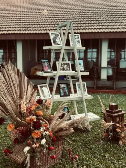 Another angle of the charming photo ladder display. This personal touch serves as a wonderful conversation starter for guests and adds a heartfelt element to the wedding decor.