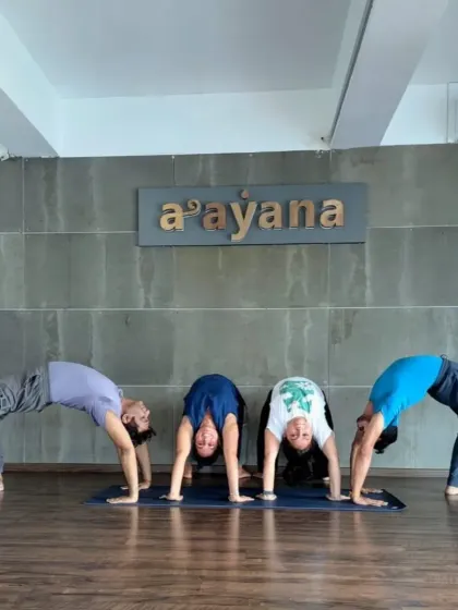 A group of students and teachers kick off the 30-day Chakrasana challenge with enthusiasm.