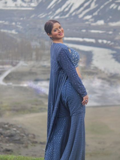 The back view of the co-ord set, highlighting the long jacket and flowing pants.