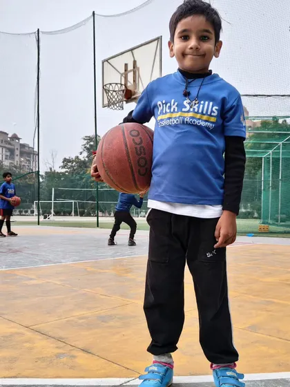 This young player is ready for practice. We foster natural curiosity and make learning enjoyable, because kids learn best when they are happy and interested.
