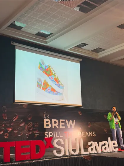 Speaking at TEDxSIULavale about my journey as a self-taught sneaker artist. Being recognized on platforms like this reinforces my commitment to disrupting the ordinary and turning a passion into a profession.
