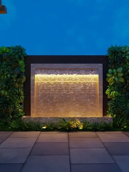 A render of a terrace designed for evening ambiance, featuring vertical green walls flanking a backlit water feature. The combination of soft lighting, stone textures, and lush foliage creates a deeply tranquil environment.