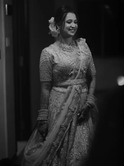 A classic black and white portrait of the smiling bride, looking timeless.
