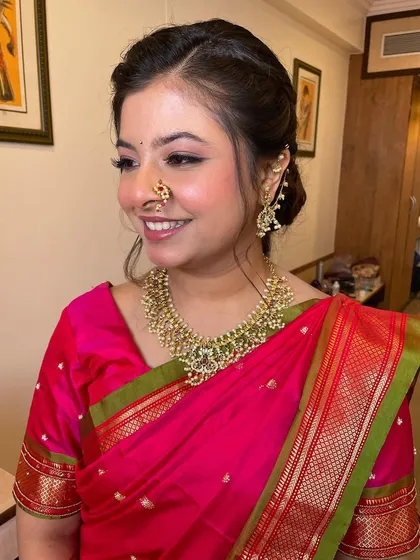 A side view of this fresh look, showing the simple yet elegant hairstyle and the beautiful pearl jewelry.