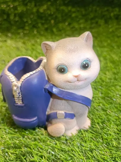 The same cat penholder design in a different color, showing the detailed craftsmanship.