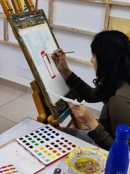 The process of creating a watercolor street scene, from the initial sketch to the final color washes.