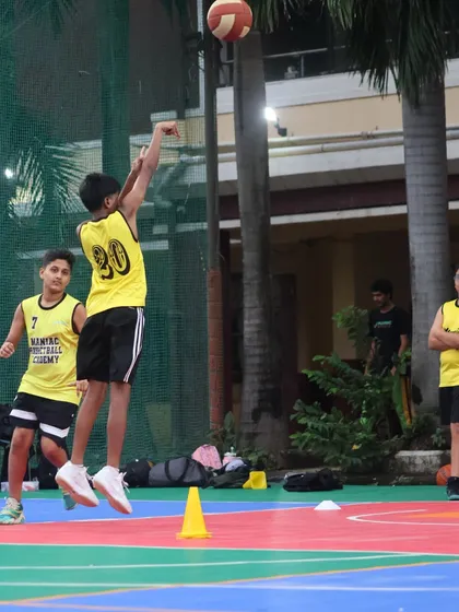 A player takes a jump shot over a cone, practicing shooting off the dribble. We use a variety of drills to develop well-rounded players.