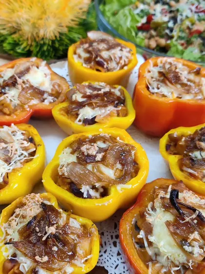 Our Mexican Stuffed Bell Peppers are baked to perfection. The peppers are filled with a savoury mix of rice and vegetables, then topped with caramelized onions and melted cheese.