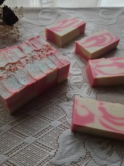 This is my HOPE soap, made with 25% shea butter for an extra decadent and moisturizing feel. The pink and white swirls are scented with a delicate rose and carnation fragrance.