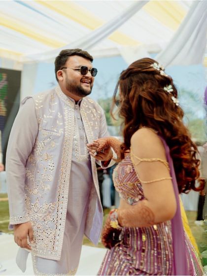 Two hearts, one journey. A beautiful candid moment between the couple during their Haldi ceremony.