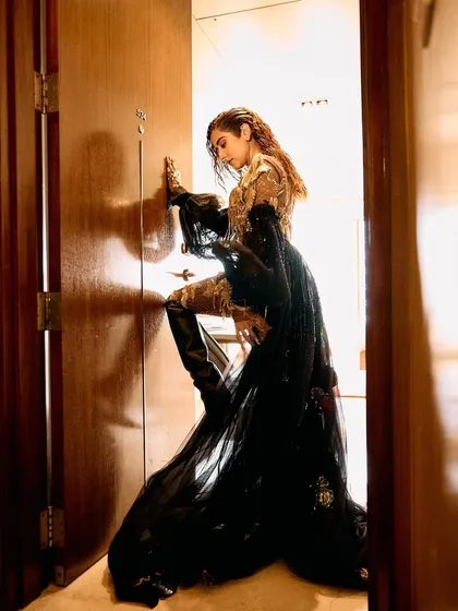 A series of images capturing the stunning Rahul Mishra Couture outfit I styled for Jonita Gandhi's performance. The detailed embroidery, flowing silhouette, and pairing with thigh-high Louboutin boots created a look that was both ethereal and powerful.
