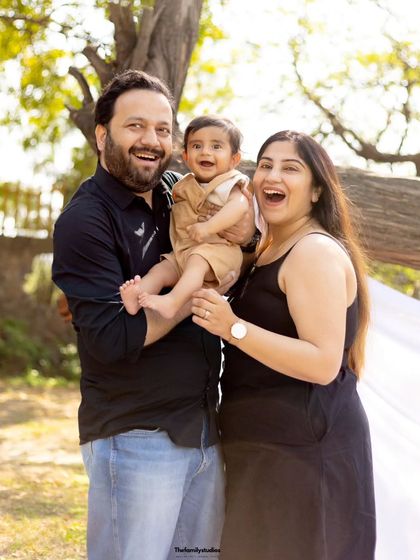 Pure, infectious laughter from a family of three during their outdoor session. Our goal is to create an environment where you can relax and let your true joy shine through.