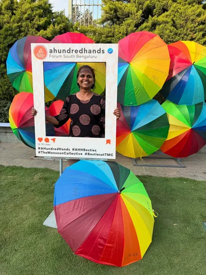 A joyful moment captured. Our photo booth, set against a backdrop of rainbow umbrellas, is a hub of smiles and happy memories.