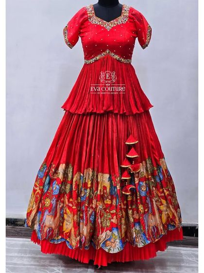 A similar layered Kalamkari gown in a striking all-red design.