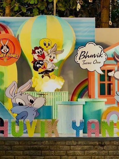 Another detailed shot of the Looney Tunes party, showing Bugs Bunny, Tweety, and other characters in a colorful scene with a hot air balloon.