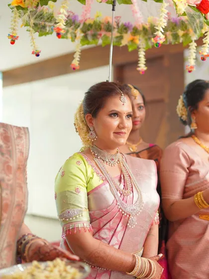 This bride's royal South Indian look is all about that radiant glow. Her skin looks luminous under the floral canopy.