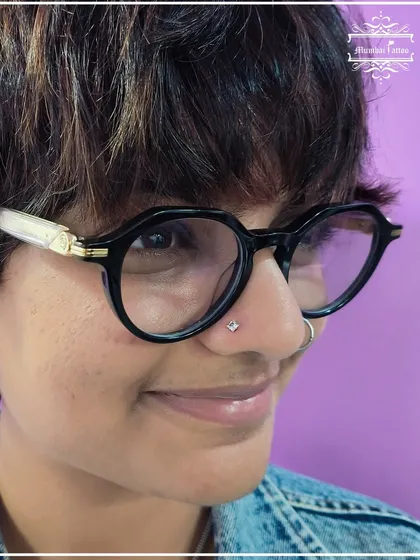 A new nose stud adds the perfect amount of bling. This client chose a square-cut gem for a unique and modern look.