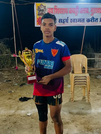 Another champion from the academy after his selection for the Sub Junior National Championship, posing with his trophy after a night tournament.