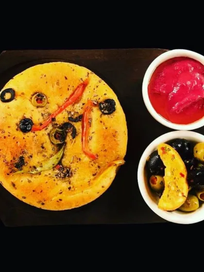 Our house-made focaccia bread, served with marinated olives and a beetroot dip. This is how we welcome you to the table, with simple, delicious flavours.