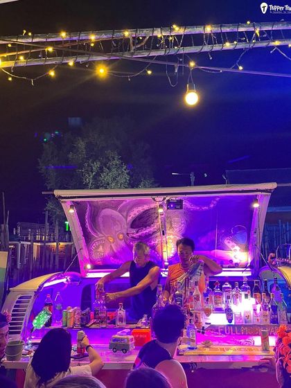 The artists behind the bar at a Thai night market. The energy, the music, and the amazing drinks are all part of the experience that makes Thailand's nightlife so legendary.