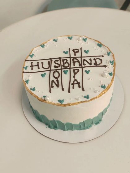 A creative crossword-style cake for Father's Day, celebrating a husband who is also a great papa.