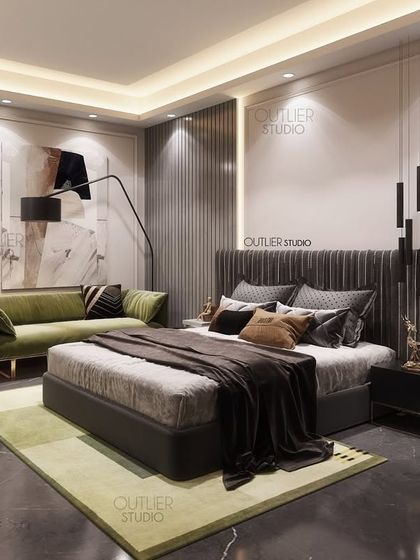 One of our favorite bedrooms, featuring a dark floor, a green sofa, and a textured headboard. The mix of materials and colors creates a space that is both sophisticated and comfortable.