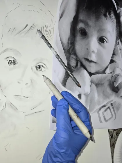 See how a portrait comes to life in our charcoal workshop. Here, a student works from a photo reference, learning to blend and shade with charcoal to capture a child's likeness and expression.