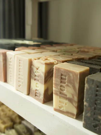The beautiful swirls and layers of different soap batches, waiting patiently on the curing rack.