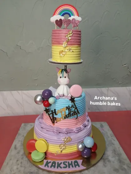 This magical unicorn cake uses a spacer to create a floating top tier among the clouds and rainbows. It's a whimsical design that little ones adore.