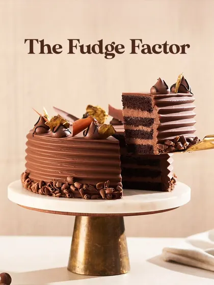 Here is my Chocolate Fudge Cake, a true showstopper for any celebration. I layer moist chocolate sponge with smooth buttercream and a rich milk chocolate ganache, then finish it with delicate chocolate flakes and gold leaf for that extra touch of elegance.