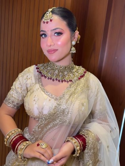 This image highlights the balanced bridal makeup, with well-defined eyes and a soft lip color, a key technique I teach for timeless looks.