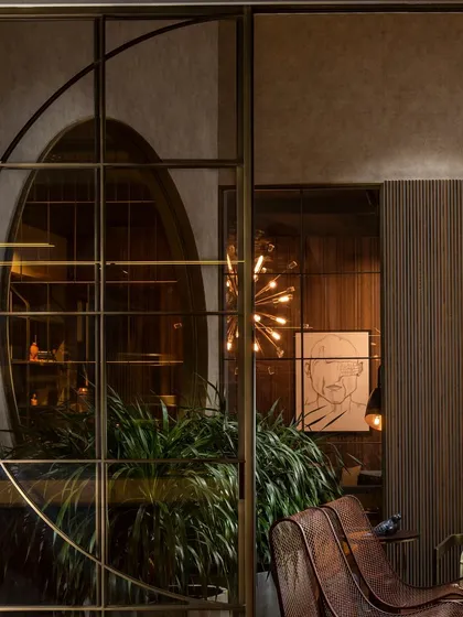 Our partitions are crafted using the finest metal profiles imported from Europe. This close-up shows the precision of the floor-to-ceiling installation, which includes inbuilt sliding doors for a clean and highly functional finish.