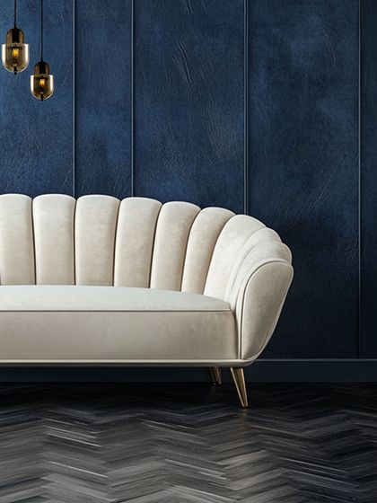 Here, I used minimalist wall lights to create a sense of stillness against a dramatic blue wall. The lighting is designed to be felt, adding a layer of quiet sophistication to the lounge area.