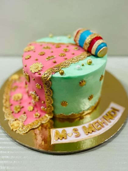 Another view of the stunning Mehndi-themed cake, showcasing the vibrant colors and detailed design.