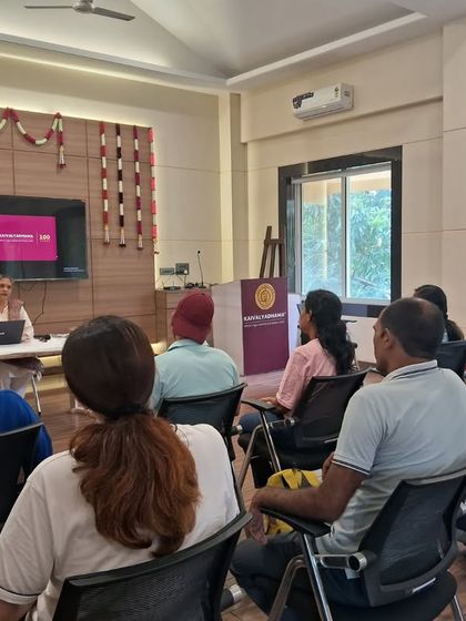 A new batch of students begins their journey with the Certificate Course in Yoga (CCY). This image captures a classroom lecture, where foundational theories of yogic science are introduced in a structured academic setting.