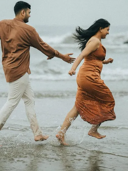 Running through the waves in Goa, a candid shot full of movement and spontaneity.
