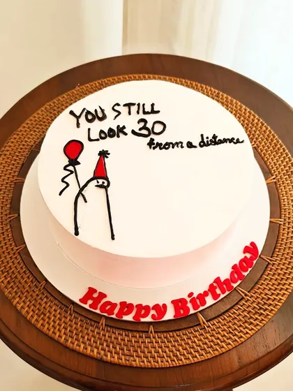 A fun and minimalist "meme" cake. The simple stick figure drawing and witty text make it a humorous and lighthearted choice for a birthday.