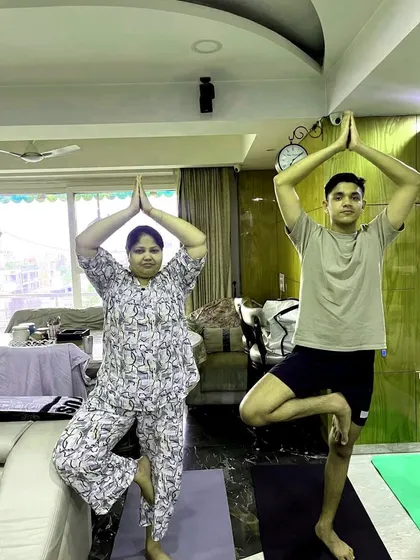 Practicing the Tree Pose with participants during a corporate yoga event. This balancing pose helps improve focus and stability.