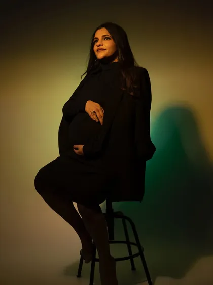 Playing with colored gels and light to create a modern, artistic portrait. This moody shot uses shadows and hues to create a unique and captivating image.