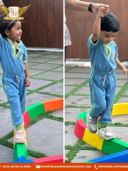 A teacher offers a helping hand as a child walks on the balance beam. Our supportive staff ensures that children feel safe as they challenge themselves and learn new skills.