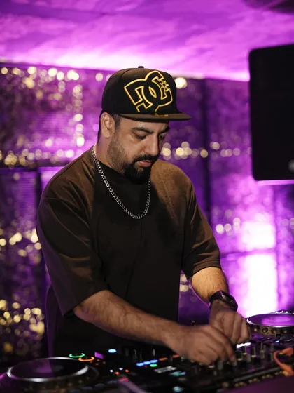 Another shot of me focused on the decks, ensuring a seamless musical journey.