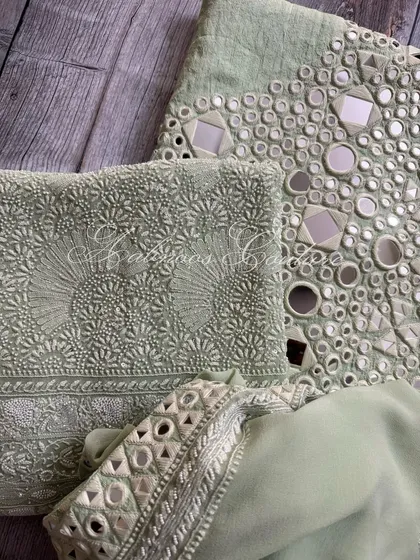 A folded view of the set, highlighting the different components and their respective embroidery styles.