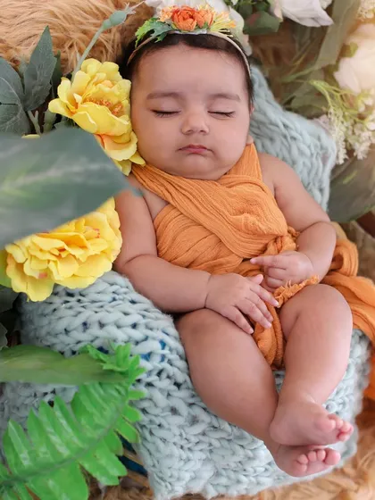 A peaceful moment as this three-month-old snoozes among the flowers. Even when they fall asleep, we can capture beautiful, serene portraits that you will cherish.