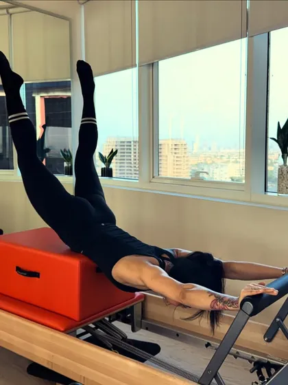 The Swan Dive on the reformer box is a beautiful exercise for strengthening the back and opening the chest. It requires control and extension through the entire spine.