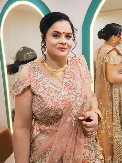 A close-up of the party makeup, showing the simple yet elegant updo and the radiant skin finish.