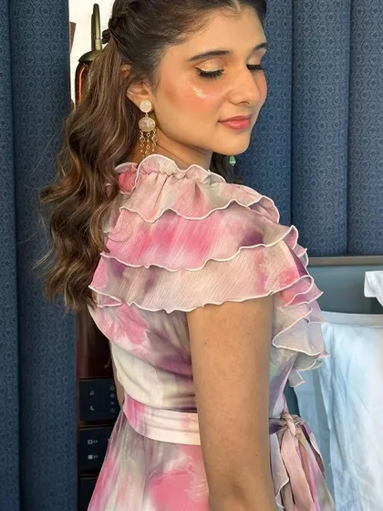 This side profile shows how the light catches the highlighter on her cheekbones, giving her a beautiful, healthy glow.