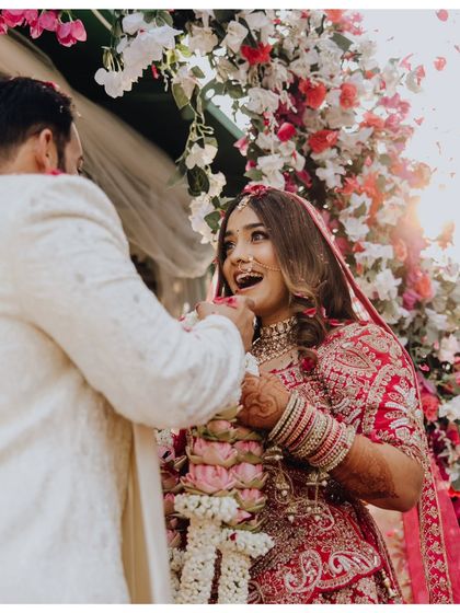 The bride's ecstatic reaction during the Varmala ceremony. This is the kind of pure, unscripted joy I aim to capture.